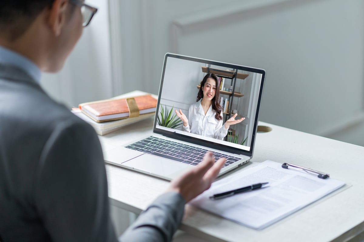 Asian Male Manager Interviewing Candidates Remotely via Videocall